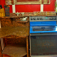 That penny counter turned out to be the bane of our existence. It took like a year to finally finish it. Then I realized that we could spray-paint the stove blue and that made me happy.     <a target='_blank' href='http://pinterest.com/pin/create/link/?media=http%3A%2F%2Fwww.katwise.com%2Fimg%2Fhouse%2Fhouse_061.jpg' title='Pin It!'  <a class='icon fa fa-pinterest fa-fw fa-lg' ></a> 